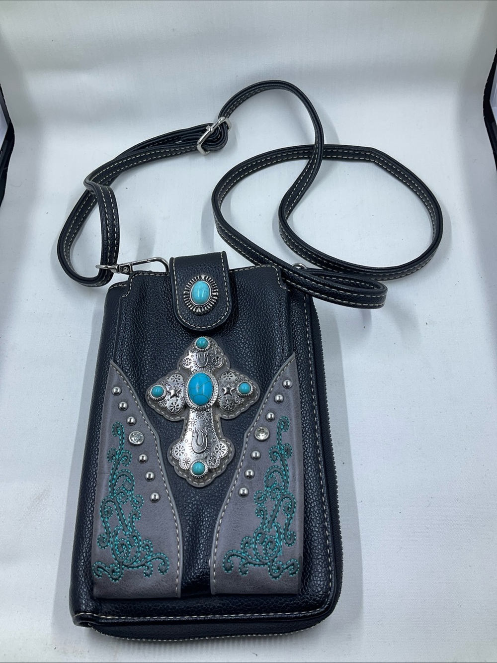 Black Leather Shoulder Bag with Turquoise Cross Accent